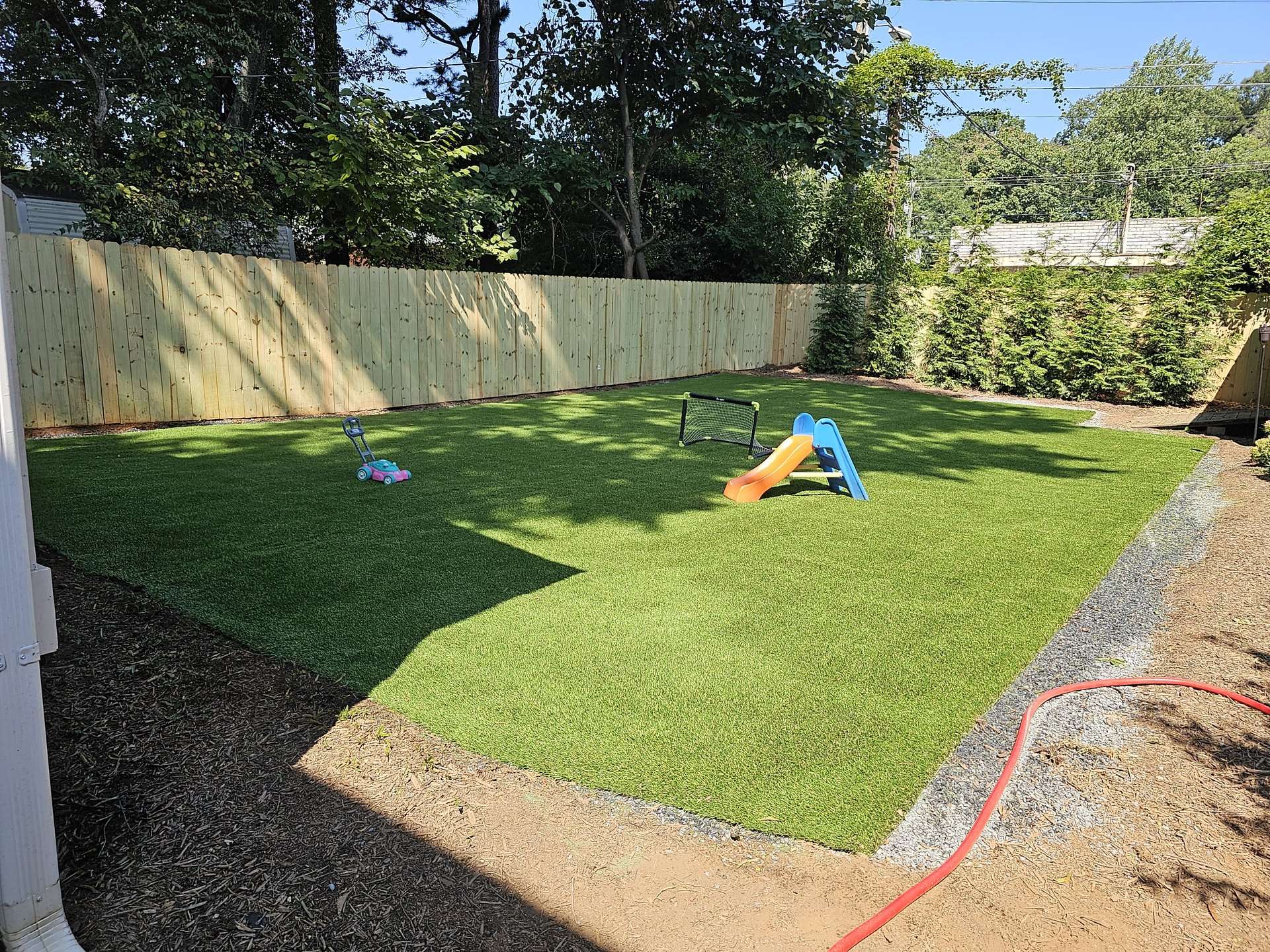 artificial turf yard with kids toys