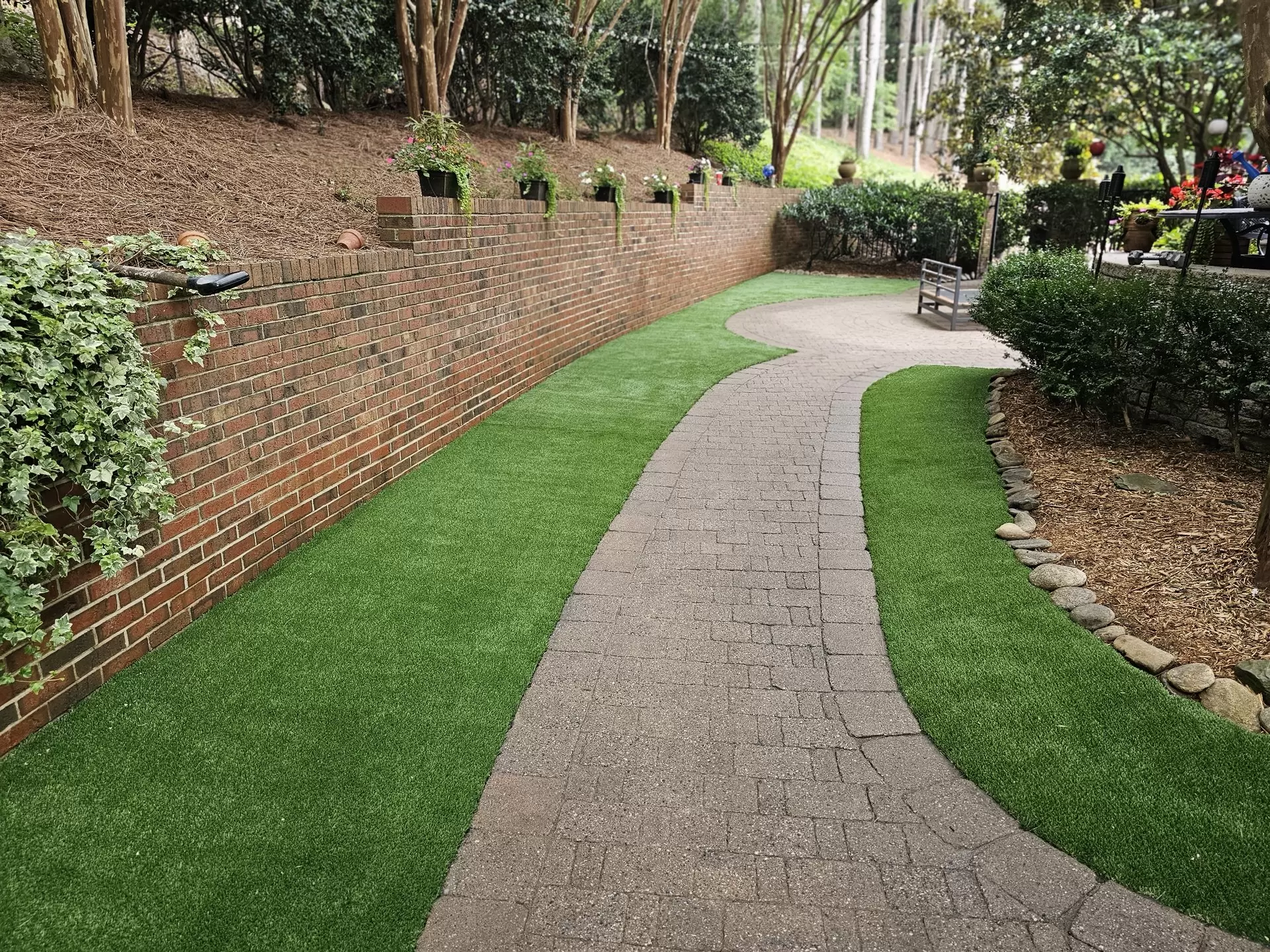 artificial turf bordered around patio