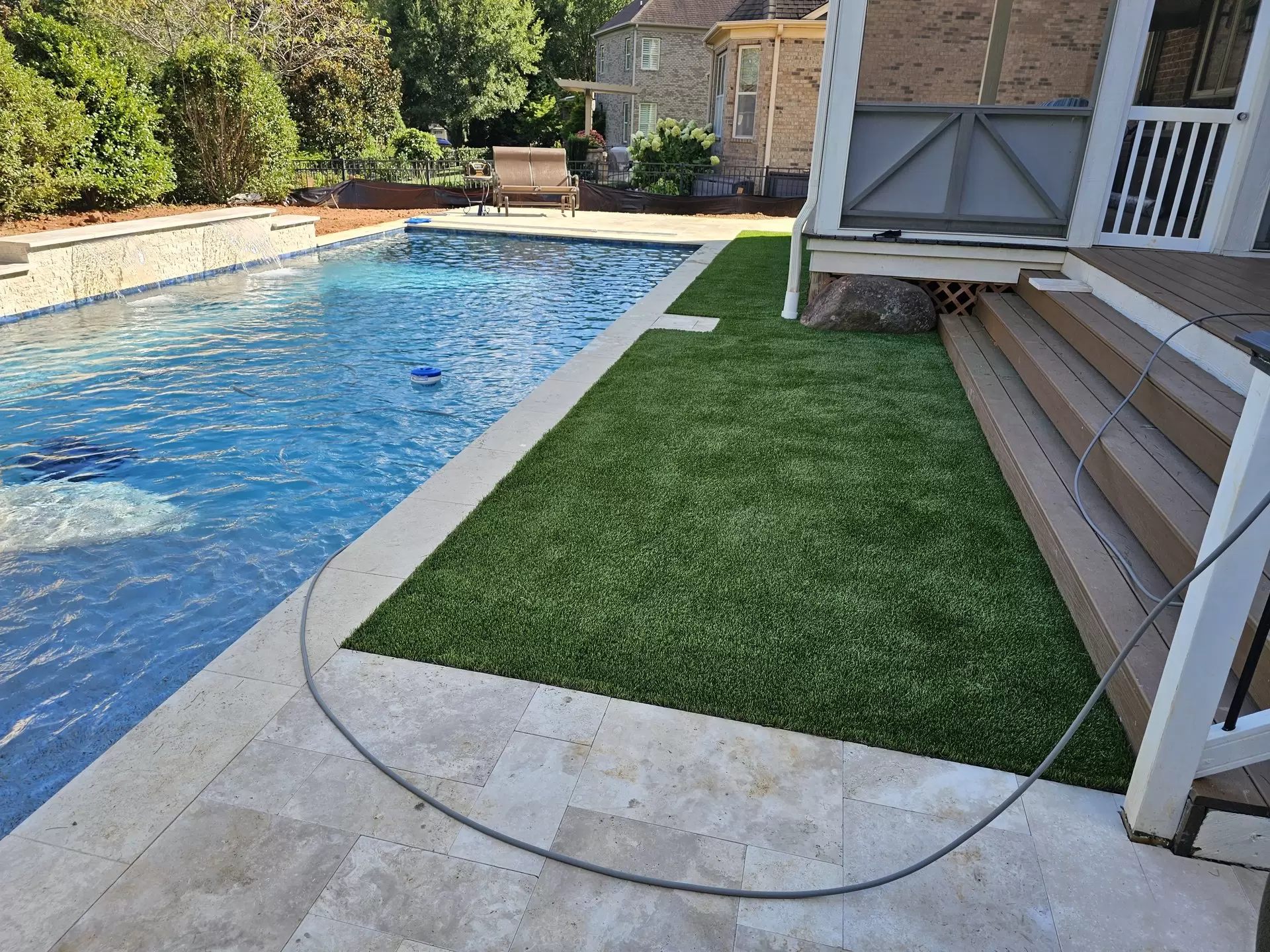 artificial turf backyard by poolside